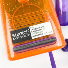 Cargar imagen en el visor de la galería, Teléfono Swatch Twinphone morado y naranja, 1989.