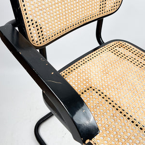 B64 or Cesca chair designed by Marcel Breuer in 1928. 