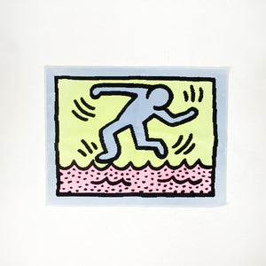 Alfombra de baño fabricada por Axis con diseño de Keith Haring.