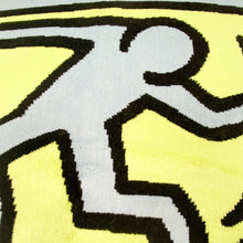 Load image into Gallery viewer, Bath mat made by Axis with design by Keith Haring. 
