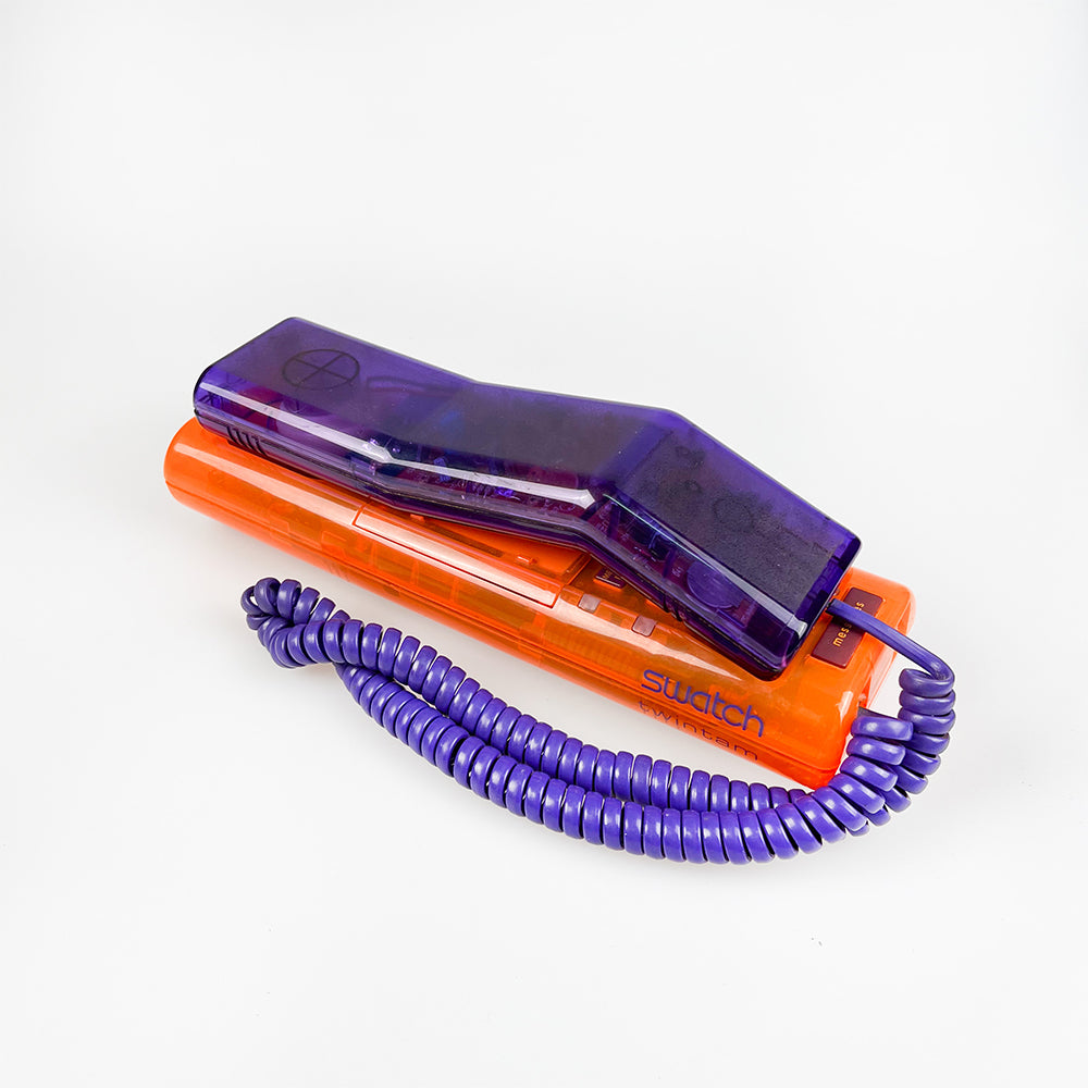 紫とオレンジのスウォッチ ツインフォン携帯電話、1989 年。 