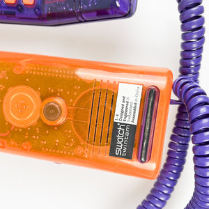 紫とオレンジのスウォッチ ツインフォン携帯電話、1989 年。 